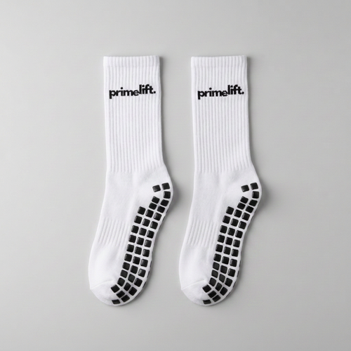 Pair of white PrimeLift non-slip gym grip socks with black sole grips