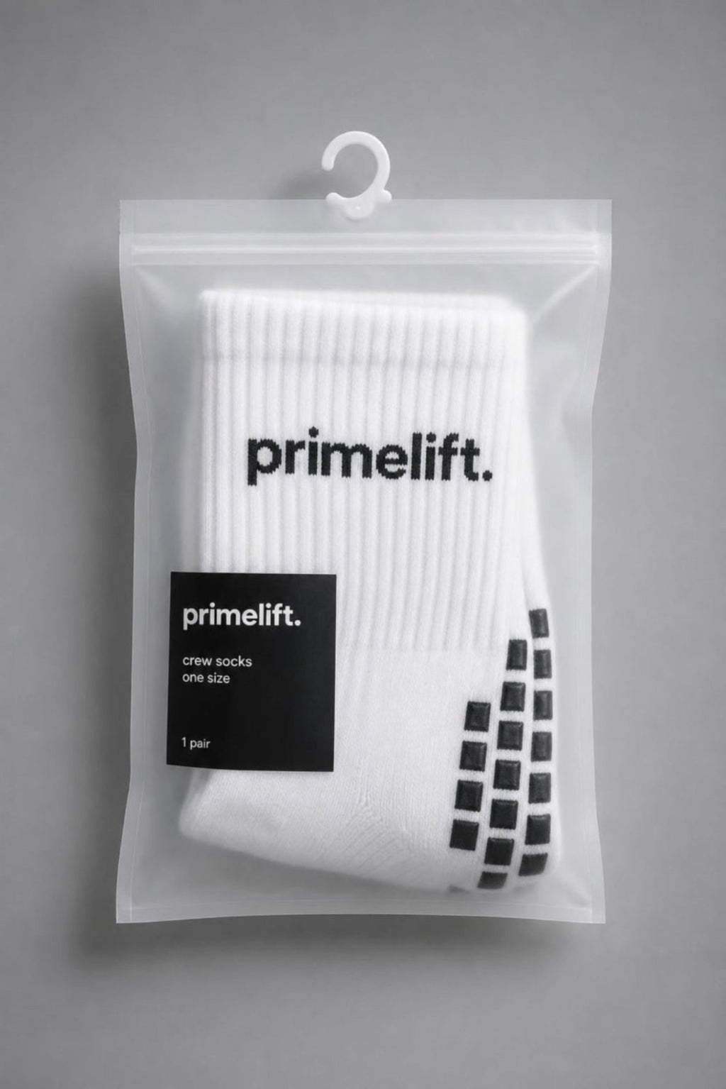 Packaged white PrimeLift non-slip gym grip socks with black sole grips